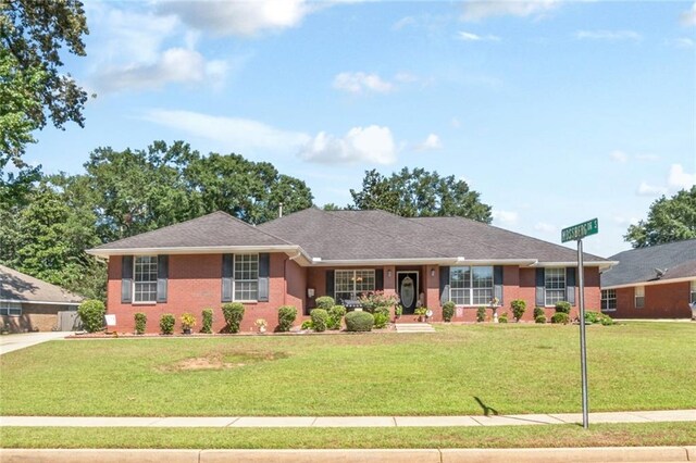 ranch-style house with a front lawn