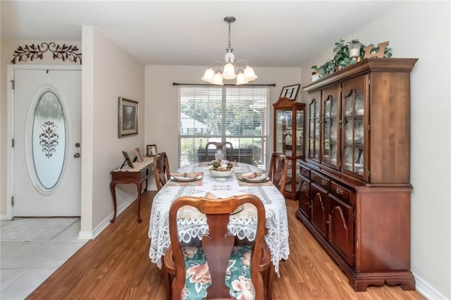 dining room featuring a notable chandelier and hardwood / wood-style flooring