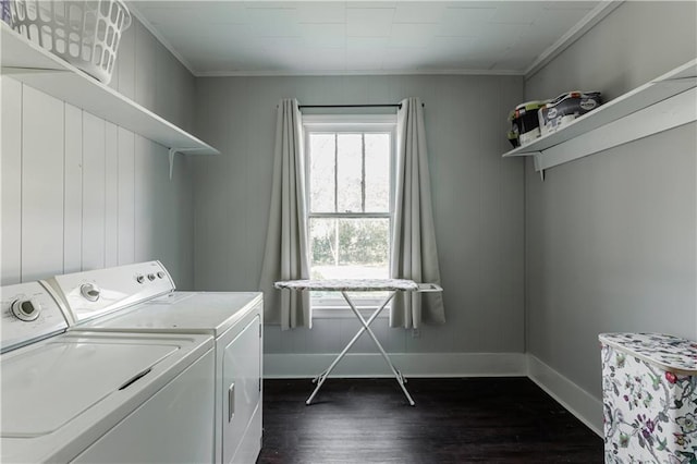 laundry area featuring independent washer and dryer, crown molding, and dark hardwood / wood-style floors