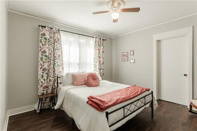 bedroom with ceiling fan, ornamental molding, and dark hardwood / wood-style flooring