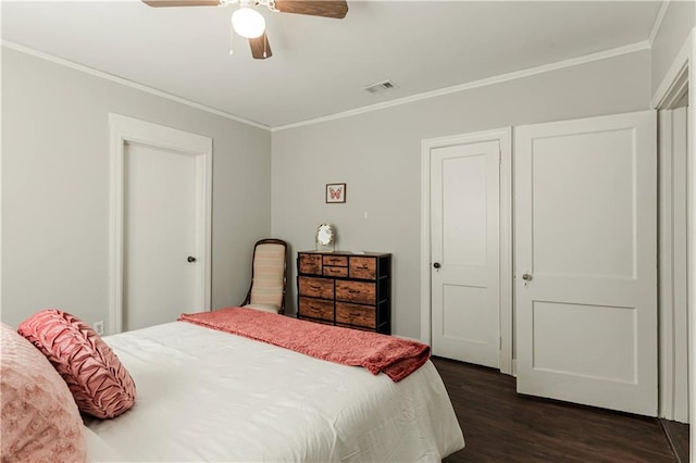 bedroom featuring ceiling fan, crown molding, and dark hardwood / wood-style flooring