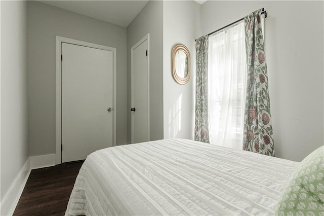 bedroom featuring dark hardwood / wood-style flooring