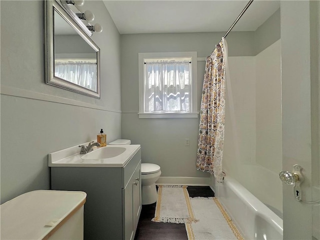 full bathroom featuring vanity, toilet, and shower / bathtub combination with curtain