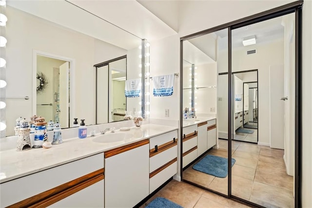 bathroom with vanity and tile patterned floors