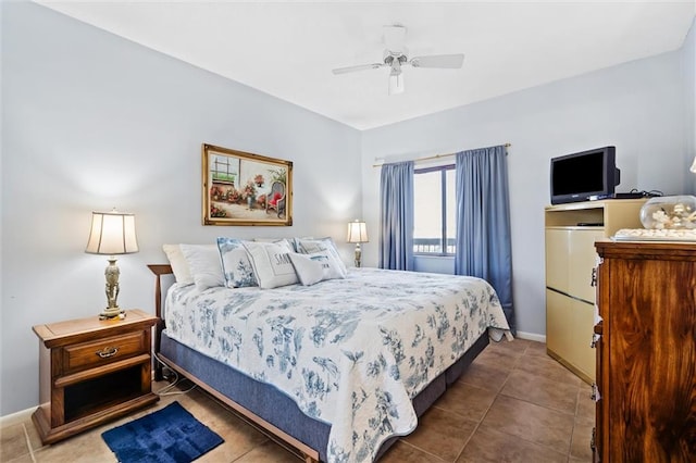 bedroom featuring tile patterned floors and ceiling fan