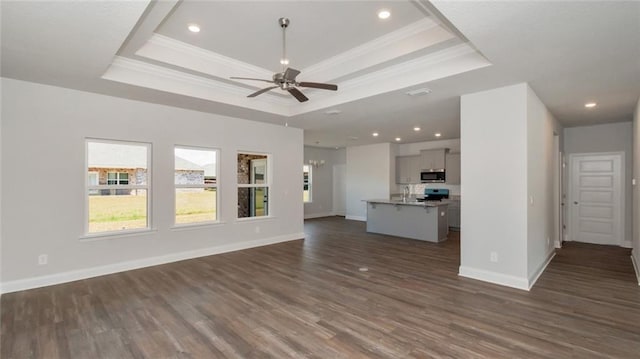 9836 Nadine Ln S, Mobile, AL 36695 - unfurnished living room with a tray ceiling, ornamental molding, a ceiling fan, dark wood-type flooring, and recessed lighting