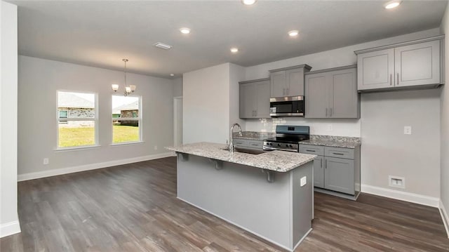 9836 Nadine Ln S, Mobile, AL 36695 - kitchen featuring stainless steel appliances, gray cabinetry, dark wood-style floors, a chandelier, and recessed lighting