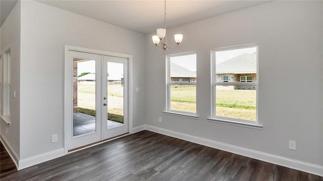 9836 Nadine Ln S, Mobile, AL 36695 - unfurnished dining area featuring french doors, dark wood-style floors, healthy amount of natural light, and a chandelier