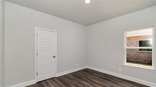 9836 Nadine Ln S, Mobile, AL 36695 - unfurnished room featuring dark wood-style floors and baseboards