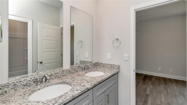 9836 Nadine Ln S, Mobile, AL 36695 - bathroom featuring double vanity and wood finished floors