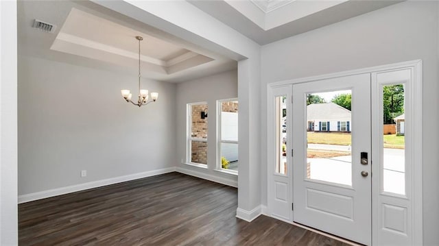 9836 Nadine Ln S, Mobile, AL 36695 - entrance foyer with a tray ceiling, dark wood finished floors, a chandelier, and ornamental molding