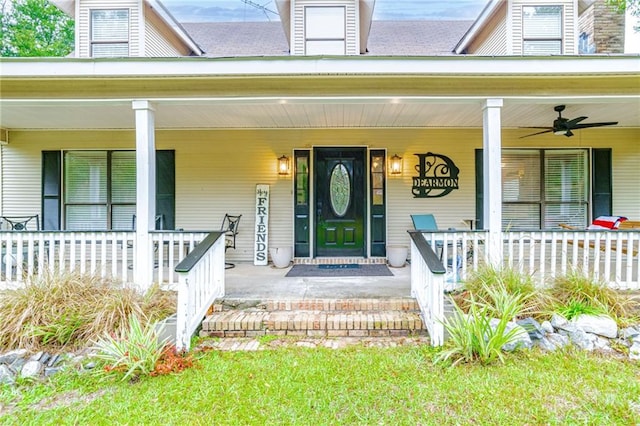 doorway to property with ceiling fan and covered porch