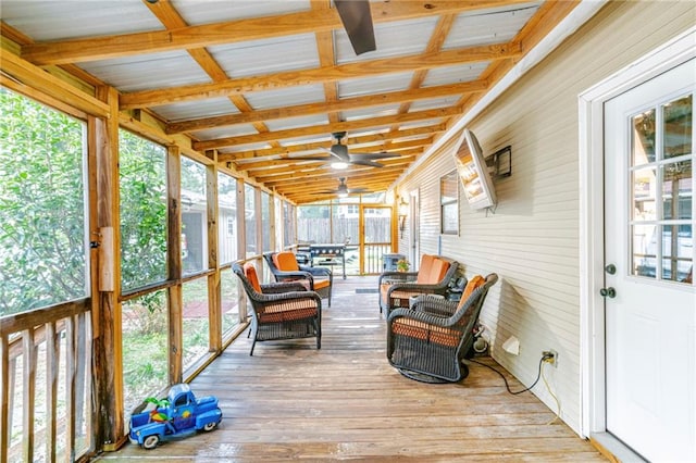 sunroom / solarium featuring lofted ceiling