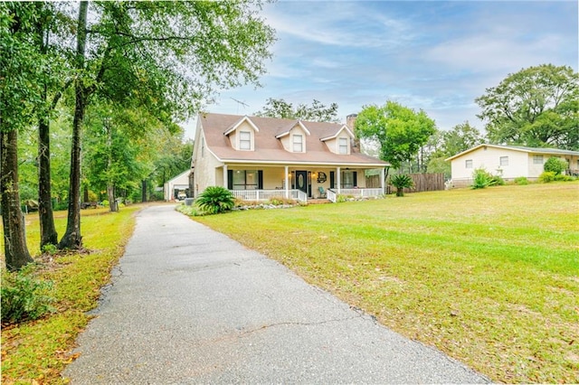 view of front of house with a front lawn and a porch