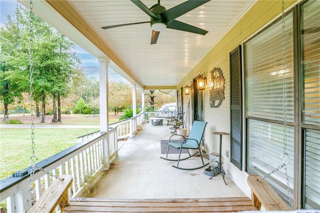 deck featuring covered porch and ceiling fan