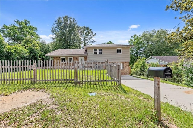 703 Townsend Cir, Chickasaw, AL 36611 - tri-level home featuring concrete driveway and brick siding