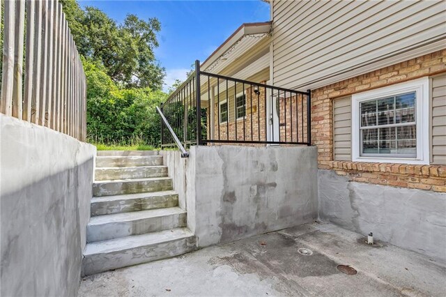 703 Townsend Cir, Chickasaw, AL 36611 - view of home's exterior featuring stone siding and stairway