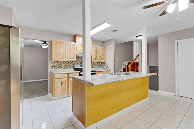 703 Townsend Cir, Chickasaw, AL 36611 - kitchen with appliances with stainless steel finishes, a sink, a ceiling fan, and light brown cabinetry