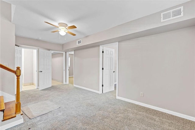 703 Townsend Cir, Chickasaw, AL 36611 - basement featuring light carpet, a ceiling fan, and baseboards