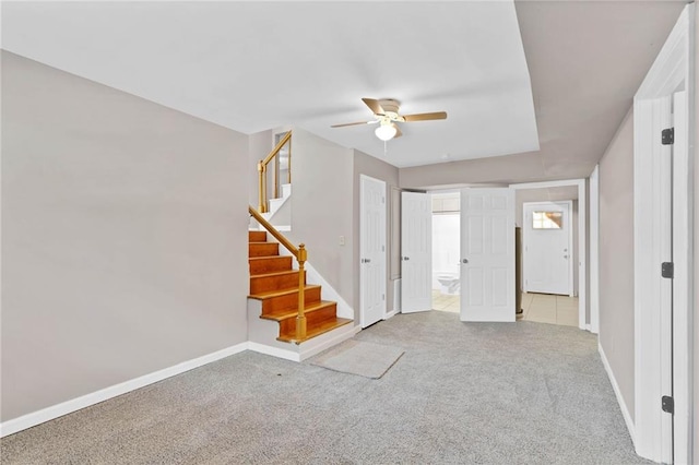 703 Townsend Cir, Chickasaw, AL 36611 - carpeted spare room featuring a ceiling fan, baseboards, and stairs
