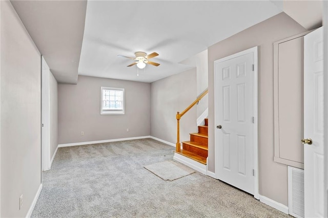 703 Townsend Cir, Chickasaw, AL 36611 - basement featuring ceiling fan, carpet flooring, baseboards, and stairs