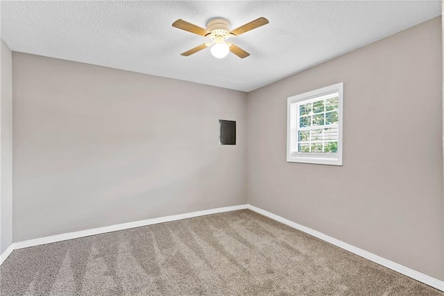 703 Townsend Cir, Chickasaw, AL 36611 - carpeted spare room featuring a ceiling fan, baseboards, and a textured ceiling
