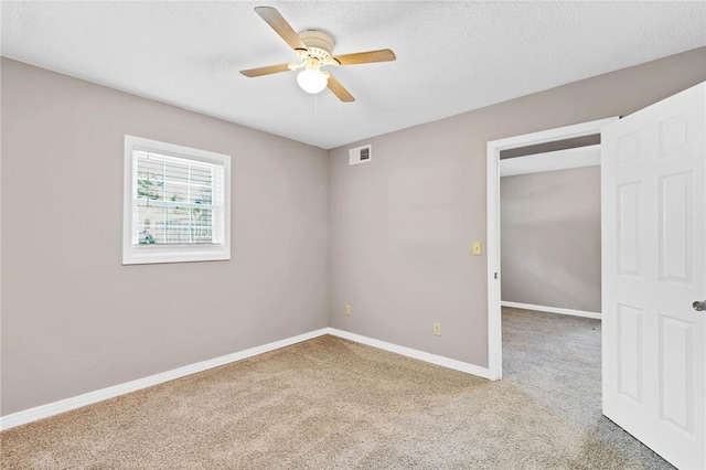 703 Townsend Cir, Chickasaw, AL 36611 - carpeted empty room with a ceiling fan, baseboards, and a textured ceiling