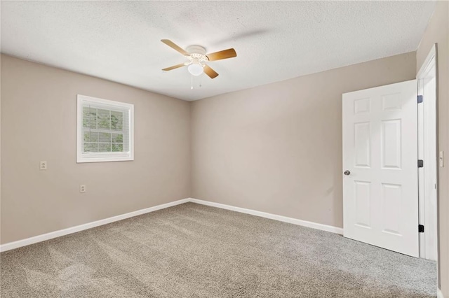 703 Townsend Cir, Chickasaw, AL 36611 - carpeted spare room featuring a ceiling fan, a textured ceiling, and baseboards