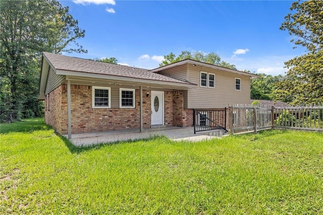 703 Townsend Cir, Chickasaw, AL 36611 - view of front of house featuring brick siding, a patio, and a shingled roof