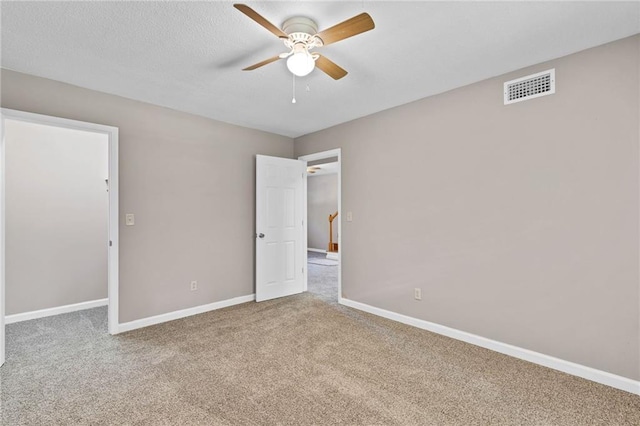703 Townsend Cir, Chickasaw, AL 36611 - unfurnished bedroom featuring carpet flooring, baseboards, and a ceiling fan