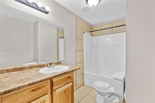 703 Townsend Cir, Chickasaw, AL 36611 - bathroom featuring vanity, toilet, tile patterned floors, and shower / bath combo with shower curtain