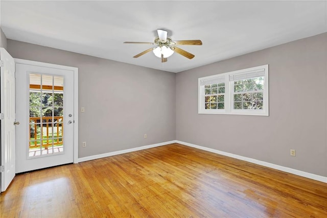 703 Townsend Cir, Chickasaw, AL 36611 - spare room featuring baseboards, light wood finished floors, and a ceiling fan