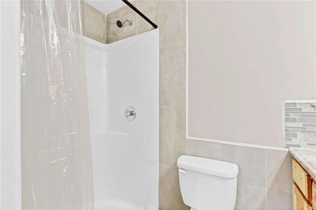 703 Townsend Cir, Chickasaw, AL 36611 - bathroom featuring tile walls, vanity, a shower with curtain, and toilet