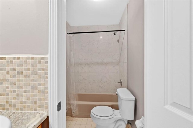 703 Townsend Cir, Chickasaw, AL 36611 - full bath with vanity, toilet, washtub / shower combination, and tile patterned flooring