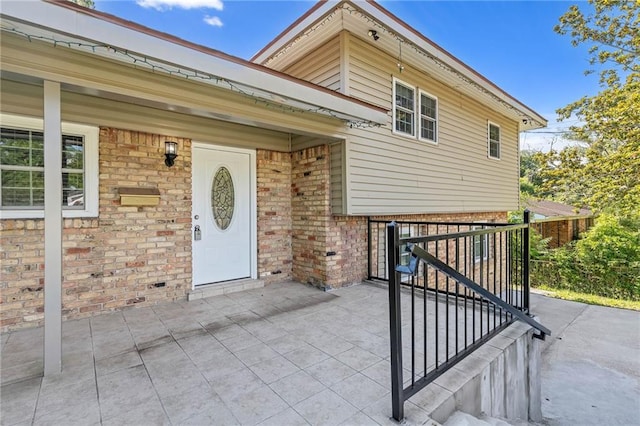 703 Townsend Cir, Chickasaw, AL 36611 - doorway to property with brick siding