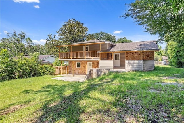703 Townsend Cir, Chickasaw, AL 36611 - rear view of house with a patio and brick siding