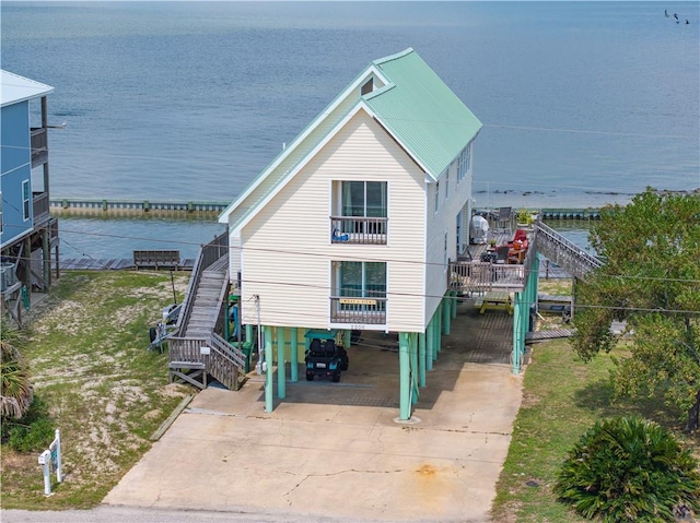 exterior space featuring a water view and a carport