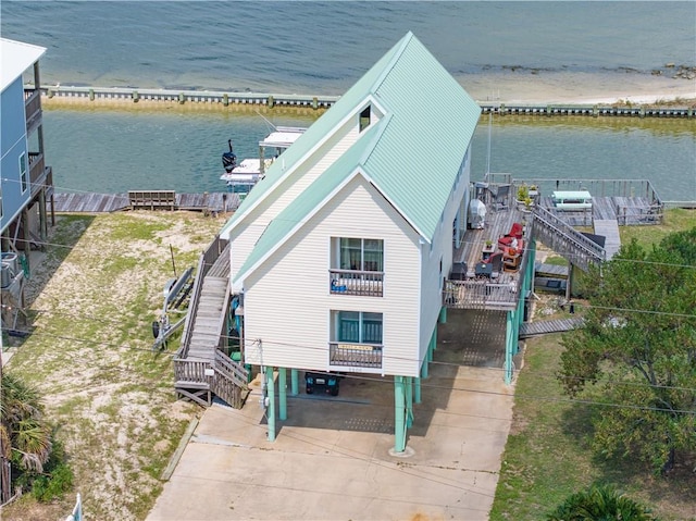 birds eye view of property with a water view