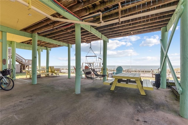 view of patio featuring a water view