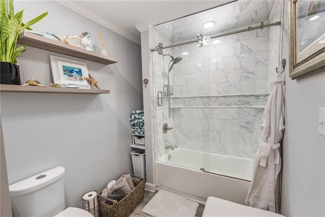 bathroom with crown molding, enclosed tub / shower combo, and toilet