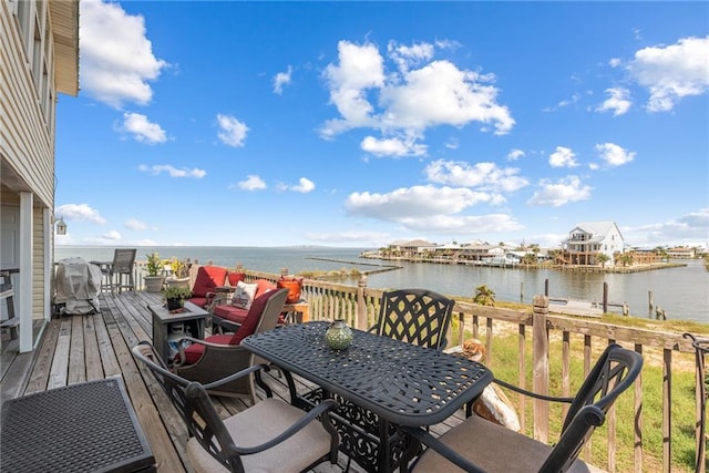 exterior space with a water view and a grill