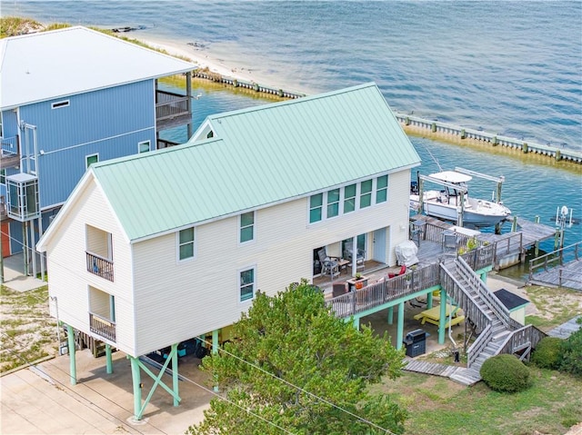 bird's eye view featuring a view of the beach and a water view