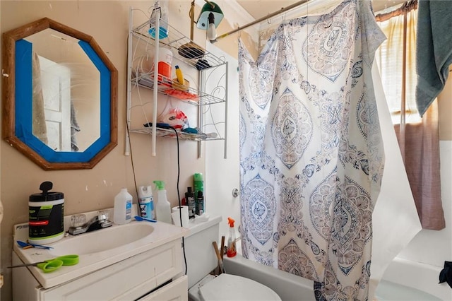 full bathroom featuring vanity, toilet, and shower / tub combo