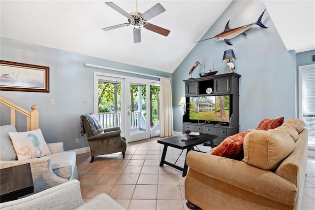 living room with ceiling fan, high vaulted ceiling, and light tile patterned flooring