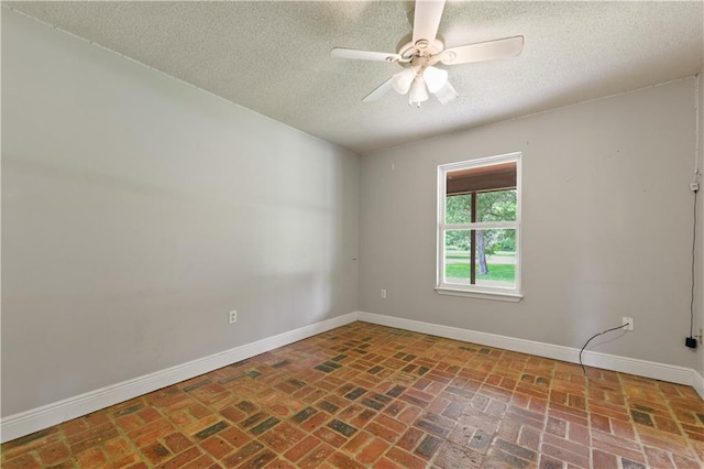 unfurnished room featuring a textured ceiling and ceiling fan