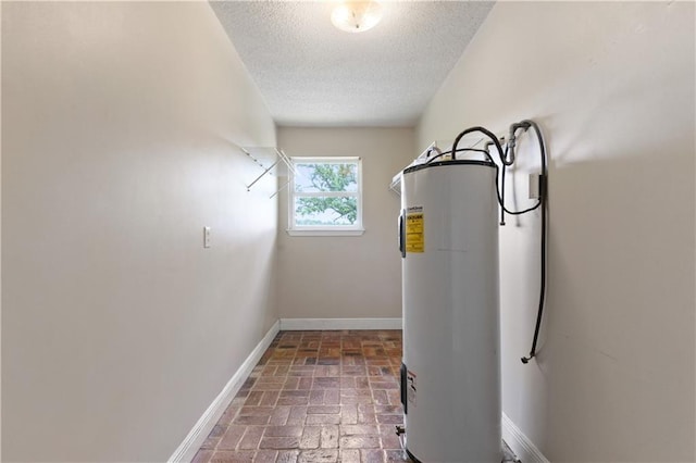 utility room featuring electric water heater