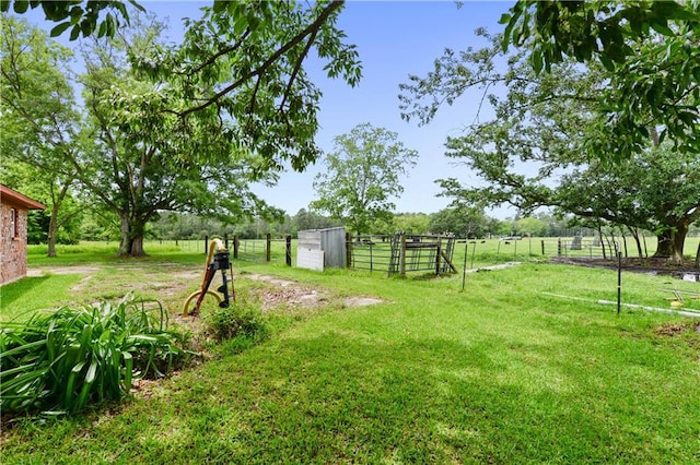 view of yard with a rural view