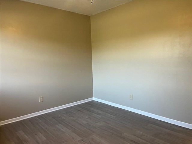 empty room featuring wood-type flooring