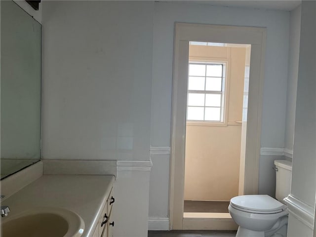 bathroom featuring vanity and toilet