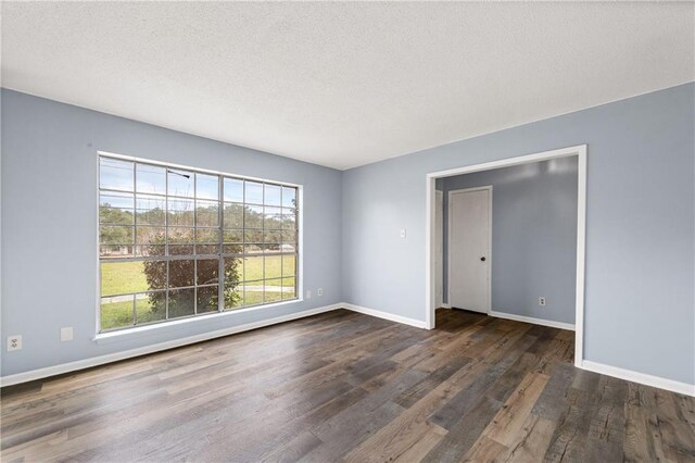 unfurnished living room with hardwood / wood-style floors, crown molding, a brick fireplace, french doors, and vaulted ceiling